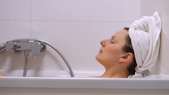 Young Woman Relaxing In Bathtub