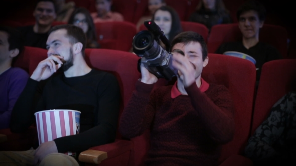 Young Man Pirating At The Cinema