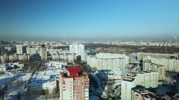 City quarters. Multi-story houses. Winter cityscape.