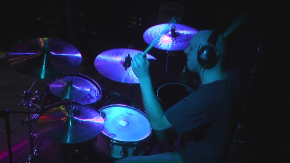 Man Playing At Drums
