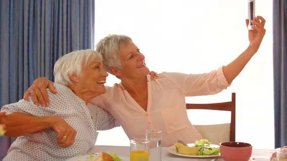 Happy senior women taking a selfie