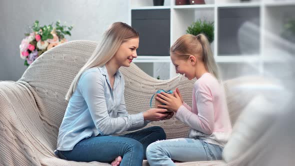 Attractive Mother Giving Gift Box Cute Teenage Daughter Celebrating Holiday Having Positive Emotion