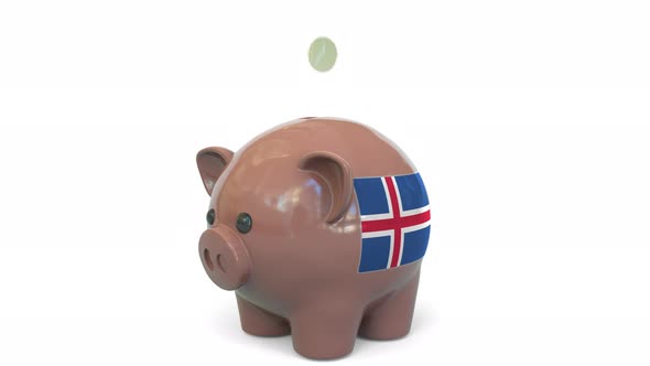 Putting Money Into Piggy Bank with Flag of Iceland alt