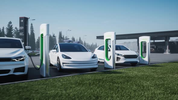 Charging Station For Electric Cars In The Background Of a Gas Station