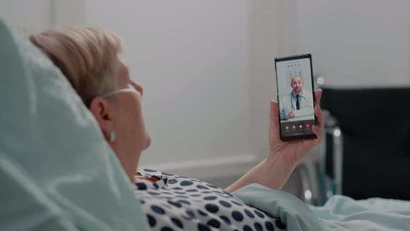 Sick Woman Holding Smartphone for Video Call Consultation