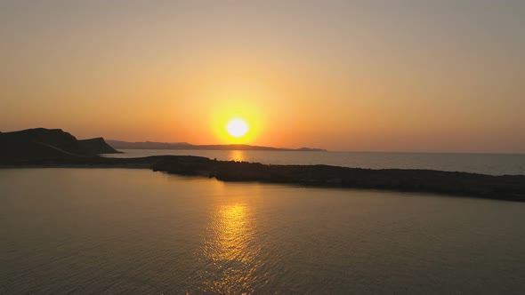 Golden Sea Waves Calmly Moving with Beautiful Sunset Over Sea