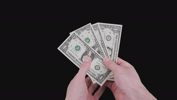 Male Hands Show Several One Dollar Bills with Alpha Channel