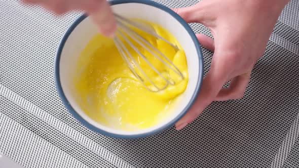 Apple Pie Cake Preparation Series  Woman Beat Eggs in a Glass Bowl with a Whisk