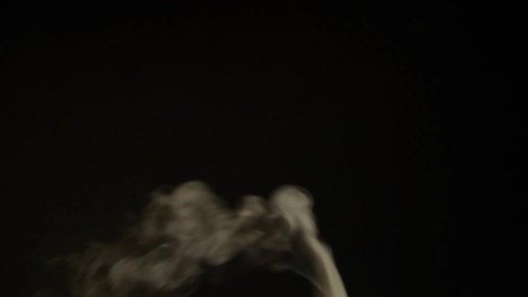 White smoke, fog, mist, vapor on a black background.