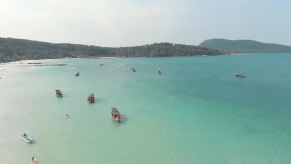 Koh Rong Samloem Island.. Aerial view of sea waters and small boats. Tropical holidays 