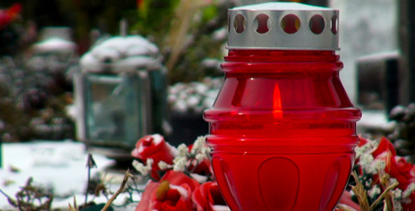 Memorial Candles On The Graveyard In Winter