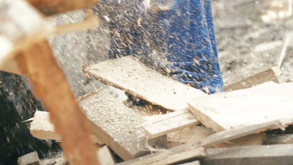 Cutting Through Wood With Chainsaw