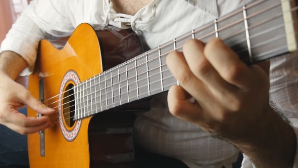 Musician Playing a Classical Guitar 