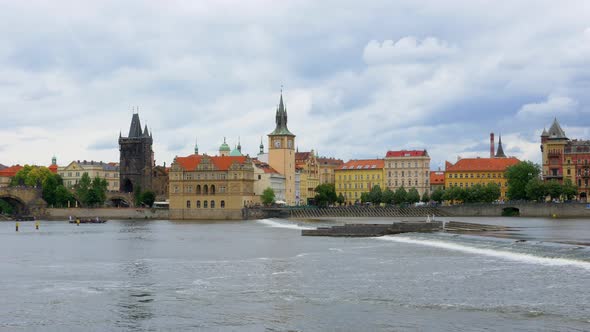 Scenic view of Old Town Prague tower on the shore of Vltava River