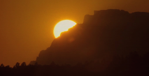 TL Setting Sun Behind Mountain