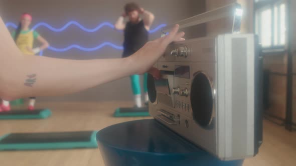 Woman Putting Tape in Recorder