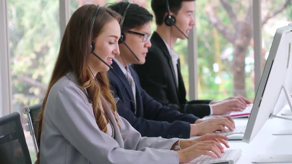 Business People Wearing Headset Working in Office