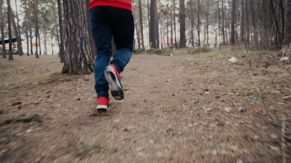 Young Man Is Running In Sunny Nature