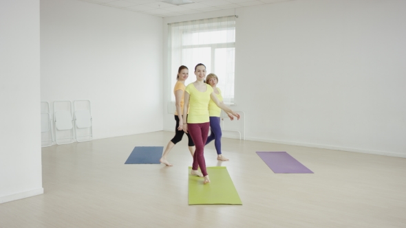 Slender Fit Women Doing Yoga On Exercise 