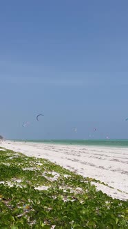 Tanzania  Vertical Video Kitesurfing Near the Shore of Zanzibar Slow Motion