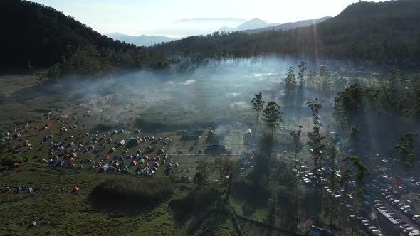 Aerial view of misty and foggy mountains valley in the morning