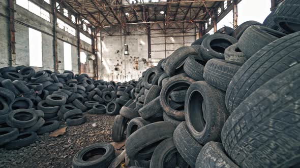 Old damaged tires after driving. Stack of car second used car rubber tires