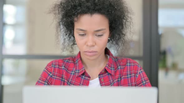 Close Up of African Woman Working on Laptop