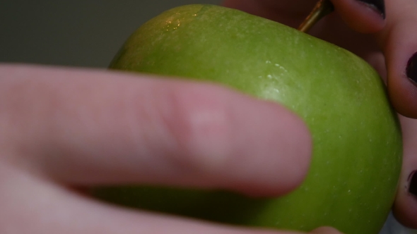 Green Apple In Female Hands