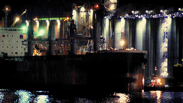 Tanker Passing Refinery On Rainy Night