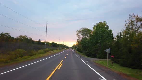 Empty freeway with sunset at the end