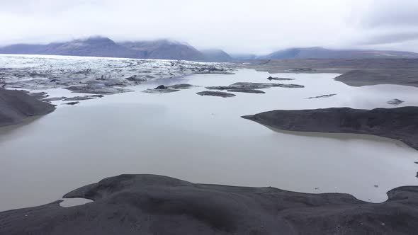 Flying Over Melting Icebergs in Svinafellsjokull Glacial Lake, Iceland