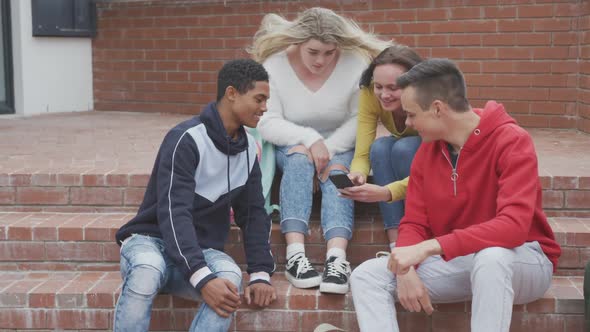 Friends having fun together outside high school 