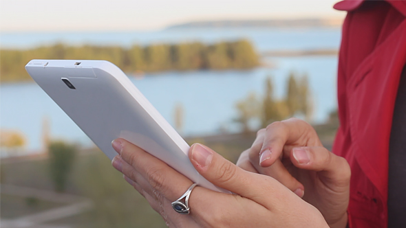 Woman Using Touchpad on the Roof