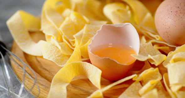 Dry Fettuccine Pasta with Egg Rotates Slowly. 