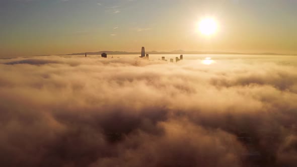 Flying Over the Clouds Towards the Sunrise