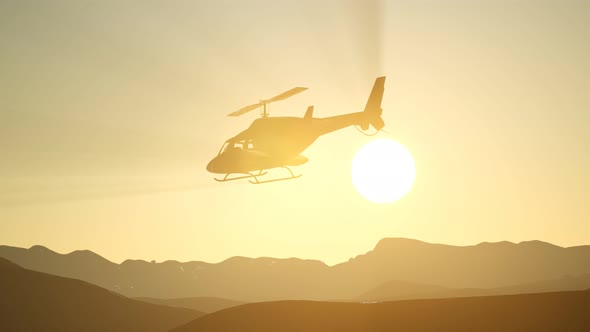 Extreme Slow Motion Flying Helicopter and Sunset Sky
