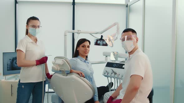 Dentist Assistant and Patient in the Dentist's Office