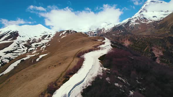 Scenic Drone Shot of Snowcapped Caucasus Mountains Kazbegi Georgia