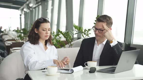 Business Lady Attentively Listen to Colleague in Restaurant