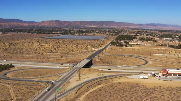 Aerial Hyperlapse of a busy freeway in the California Mojave Desert on a summer day