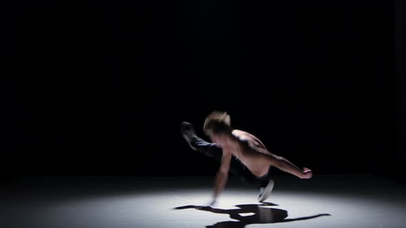 Breakdance Blonde Dancer with Naked Torso Starts Dance on His Hands, Black, Shadow