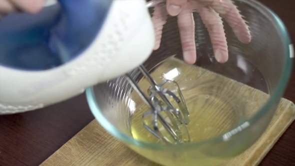 Beating Eggs With Electric Mixer. Cake Ingredients. Food Prepare. Baking Tools