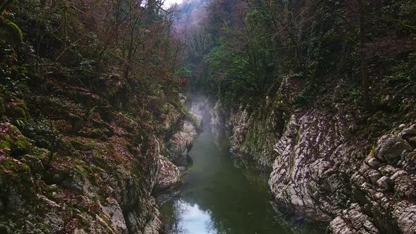 River in a Narrow Canyon with White Rocks