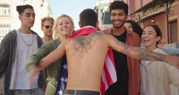 Young Protester with USA Flag Walks to Multiracial Activists and Hugging Them