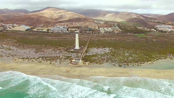 Aerial view of Morro Jable Lighthouse with cloudy weather.
