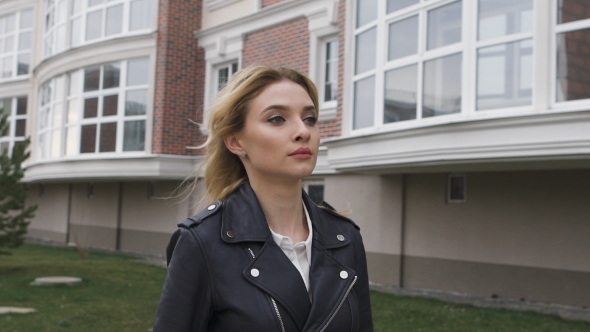 Beautiful Young Woman Walking On The Street 