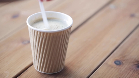 Hand Adding And Stirring Sugar In Cup Of Coffee 43