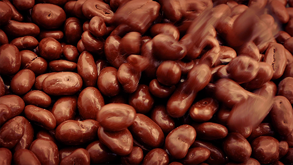 Pouring Chocolate Coated Peanuts