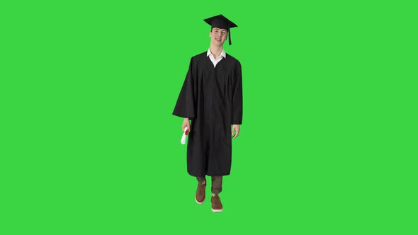 Graduate Student Smiling and Walking with Diploma on a Green Screen Chroma Key