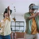 Dad and son wear VR or virtual reality glasses,headsets standing and playing a video game - VideoHive Item for Sale